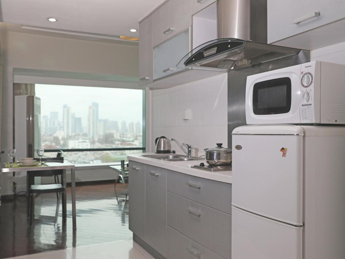 Shanghai Cosmo World Union Service Apartment Екстер'єр фото